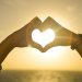Canva - Two People Forming Heart Sign to Sun